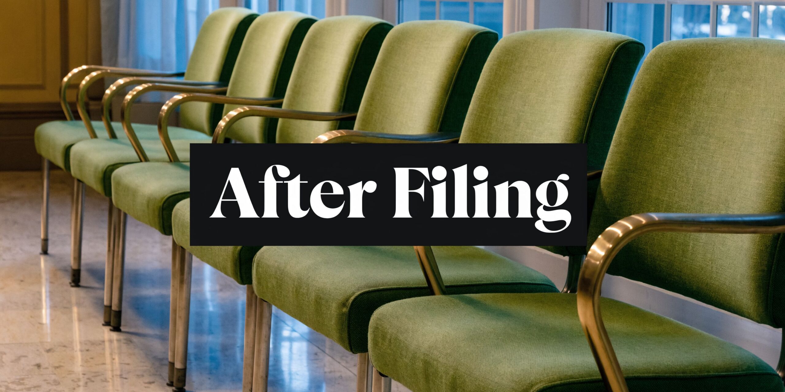 A row of empty vintage green chairs lined up in a room for an after filing concept.
