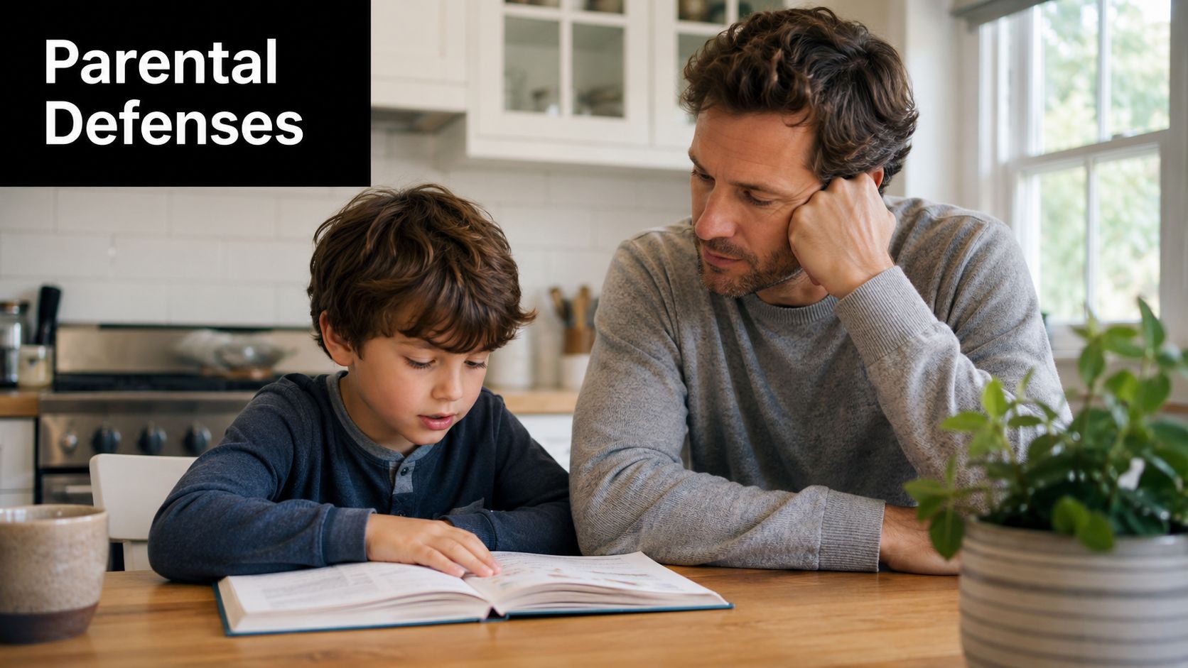 A caring father sits at a wooden table helping his young son study from an open book.